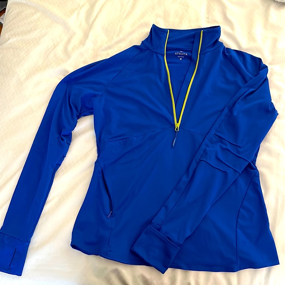 Athleta royal blue half zip with thumb holes, contrasting zip & fun back detail